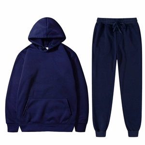 Flat lay of dark blue two-piece tracksuit with hoodie and drawstring sweatpants