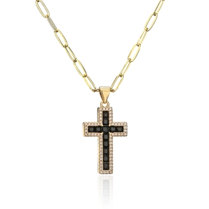 Detail of 18K gold paperclip chain necklace with a black zircon cross pendant