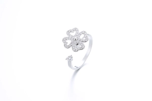 Macro shot of silver spinning four-leaf clover ring with cubic zirconia stones