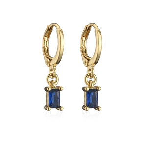 Detailed view of gold hoop earrings with rectangular blue zircon gemstone pendants