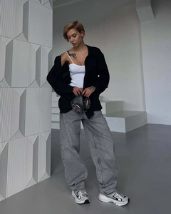 Detailed look at vintage washed grey high-waisted wide-leg jeans with a retro streetwear style
