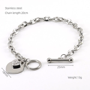 Detailed view of silver stainless steel bracelet with double heart charms and OT toggle clasp