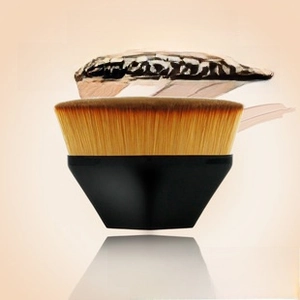 Close-up of #55 flat top foundation brush with dense bristles and black handle