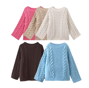 Detailed view of cable knit textures in pink, oatmeal, cream, coffee, and sky blue sweaters
