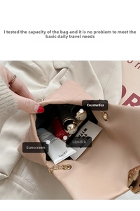 Interior view of light pink quilted shoulder bag showing spacious storage for cosmetics