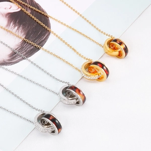 Interlocked double ring necklaces with crystal accents in gold and silver finish