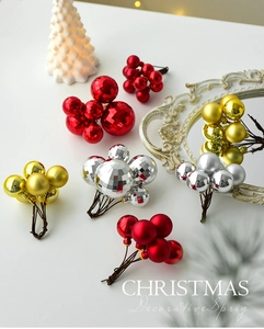Detailed view of festive red gold and silver Christmas decorative sprigs on a table