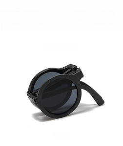 Foldable round kids sunglasses in black with portable hinge detail and UV protection