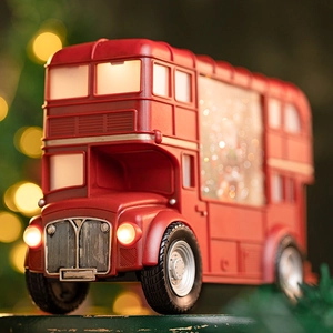 Red double-decker Christmas bus lantern with swirling glitter and warm internal lighting