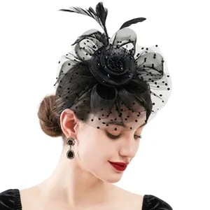 Detailed close-up of a vintage black mesh fascinator hat with feathers and dots