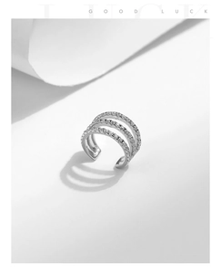 Macro detail of 925 sterling silver triple-layer ear cuff with shimmering pave zircon stones