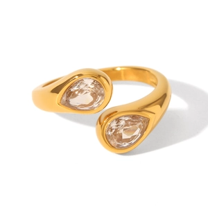 Detailed macro view of 18K gold plated stainless steel ring with double teardrop zircon