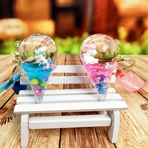 Cute unicorn liquid ice cream keychains in pink and blue with flowing glitter