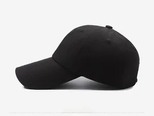 Detailed side view showing white NALAS embroidery on a black twill baseball cap