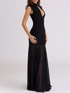 Detail of a black sleeveless bodycon dress with hollow-out neck and sheer chiffon hemline
