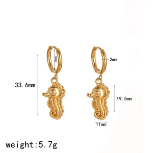 Gold seahorse hoop earrings in stainless steel with detailed wave texture for women