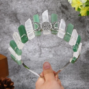 Handmade crown headband with green and clear crystals featuring a moon sun metal charm