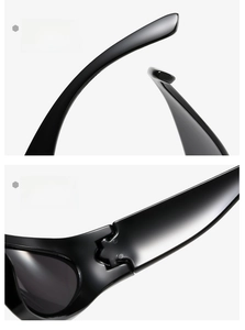 Close-up of sleek black punk sunglasses featuring curved legs and durable metal hinges