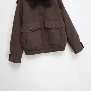 Women's brown faux leather jacket featuring a thick faux fur collar and cargo pockets
