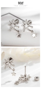 Detailed view of silver star stud earrings with micro-set zircons and screw back