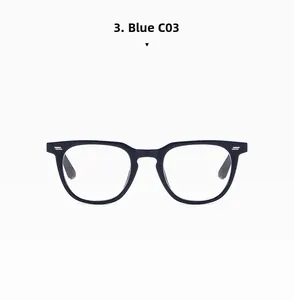 Close-up of navy blue glasses frame with stylish silver rivets and modern Boston shape