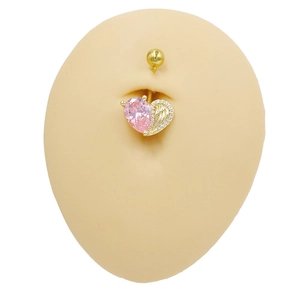 Golden heart navel ring with pink zircon and angel wings on realistic silicone model