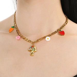 Detail of gold Cuban chain necklace with colorful mushroom and vegetable charms on neck