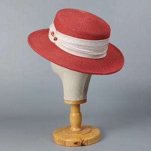 Elegant red flat top straw hat for women with cream ribbon and decorative buttons