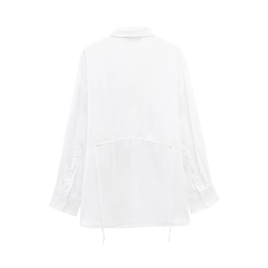 Detail of white long-sleeved shirt featuring back drawstring and horizontal seam detail