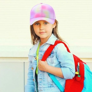 Close-up of kids colorful tie-dye baseball cap with pink and purple gradient tones