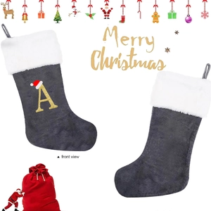 Gray velvet Christmas stocking with white faux fur trim and gold sequin letter A