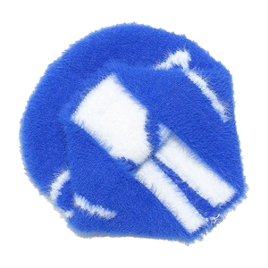 Close-up of the plush blue and white bow pattern texture on a warm winter beanie