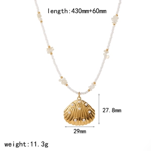 Beaded shell necklace with gold pendant and white pearls, casual beach jewelry for women