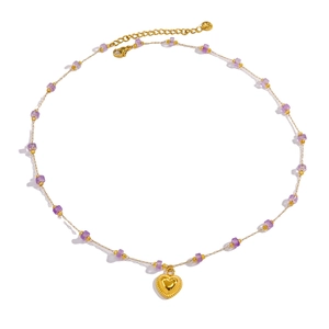 Handmade gold plated necklace featuring purple beads and a heart pendant for women