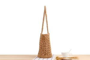 Detailed macro view of the hollow crochet weave and soft inner lining on this beach bag