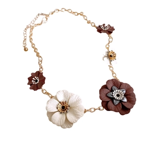 Elegant gold chain necklace with brown and white leather flower pendants for women