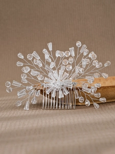 Detail of bridal hair comb featuring handmade crystal beads and floral silver wire