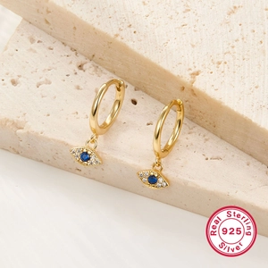 Detailed close-up of S925 sterling silver evil eye hoop earrings with blue gemstone