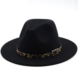 Detailed close-up of the leopard print band and gold buckle on a black wool fedora hat