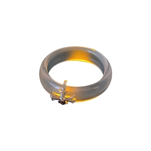 Minimalist chalcedony resin cross ring with silver gothic pendant on white background