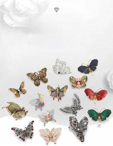 Detailed close-up of colorful alloy butterfly brooches with rhinestones and enamel craft