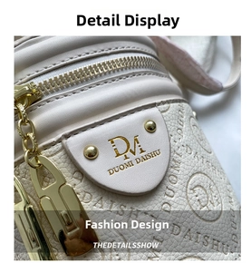 Close-up of beige leather bag with DAISHU embossed texture and light gold zipper
