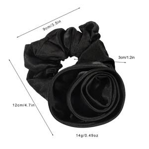 Elegant black satin rose flower scrunchie with silky finish measuring 12cm in diameter
