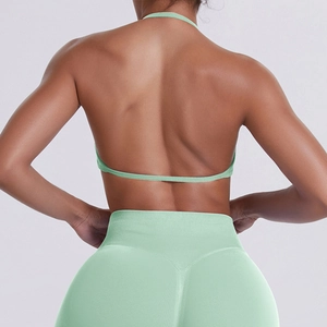 Close-up of mint green halter backless sports bra and seamless high waist yoga leggings