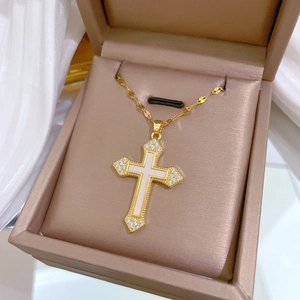Luxurious gold titanium necklace with sparkling crystal shell cross pendant in jewelry box