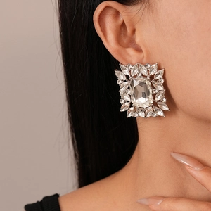 Macro shot of vintage silver earrings with large square and marquise-cut crystals