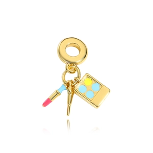 Gold charm pendant featuring a miniature lipstick, makeup brush and colorful eyeshadow palette