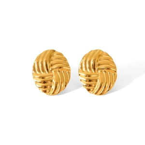 Macro view of woven oval 18K gold plated stainless steel stud earrings set on white