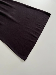 Detail view of the fine knit hem and premium stitching on this elegant dark dress