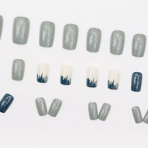 Chic blue and grey square press-on nails featuring mountain patterns and glitter accents